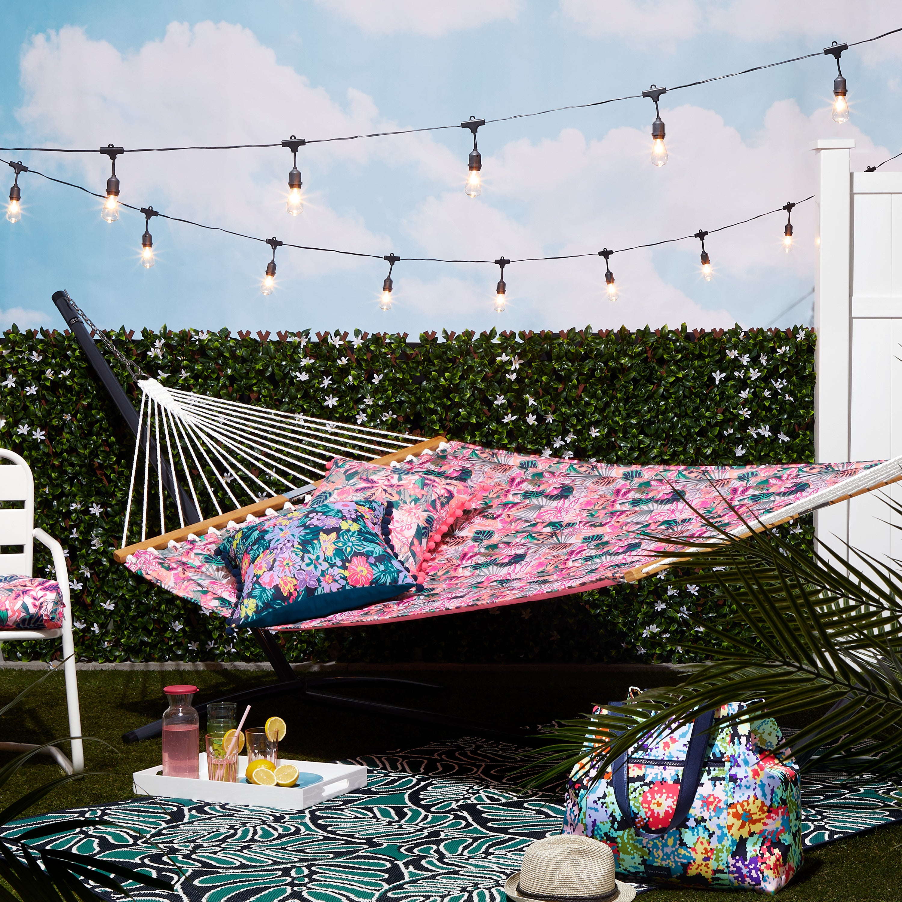 50-128_PATIO_VeraBradley_Hammock_Rug_AccentPillows_RainforestCanopyCoral_Blooms_Lifestyle.jpg